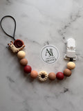Attache suce Escargot brun/rouge avec fleur beige