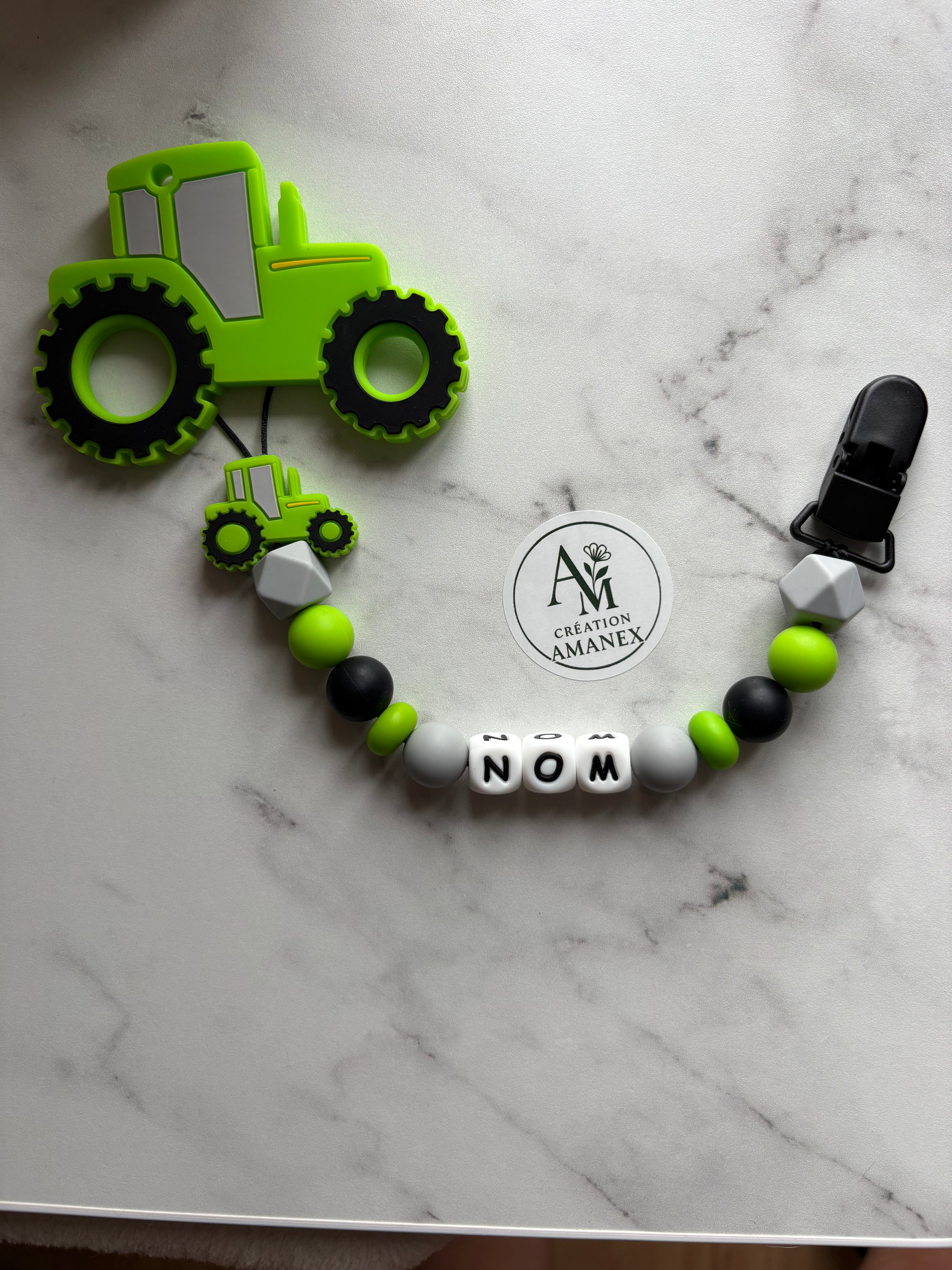 Attache suce et jouet de dentition Tracteur vert