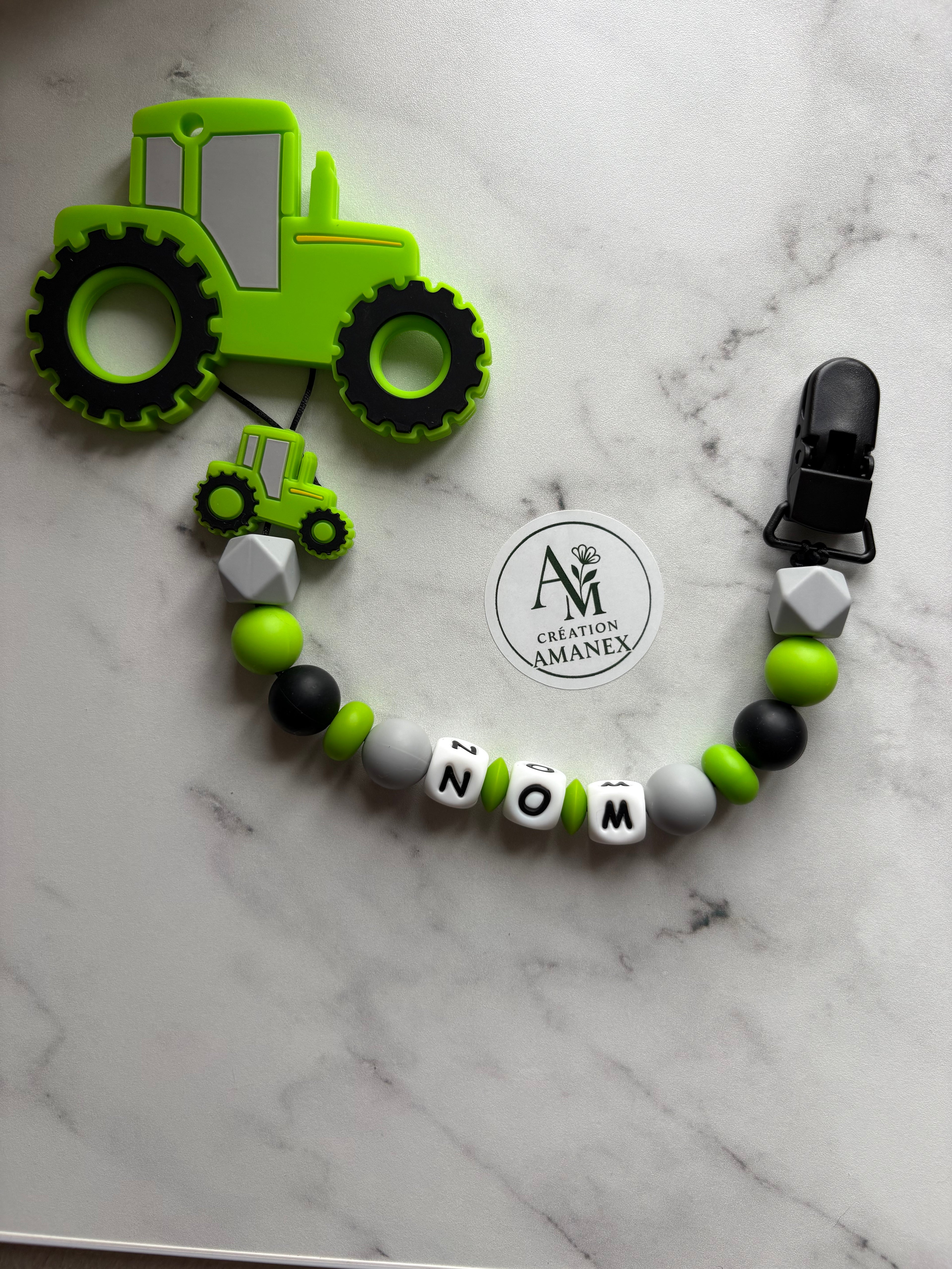 Attache suce et jouet de dentition Tracteur vert