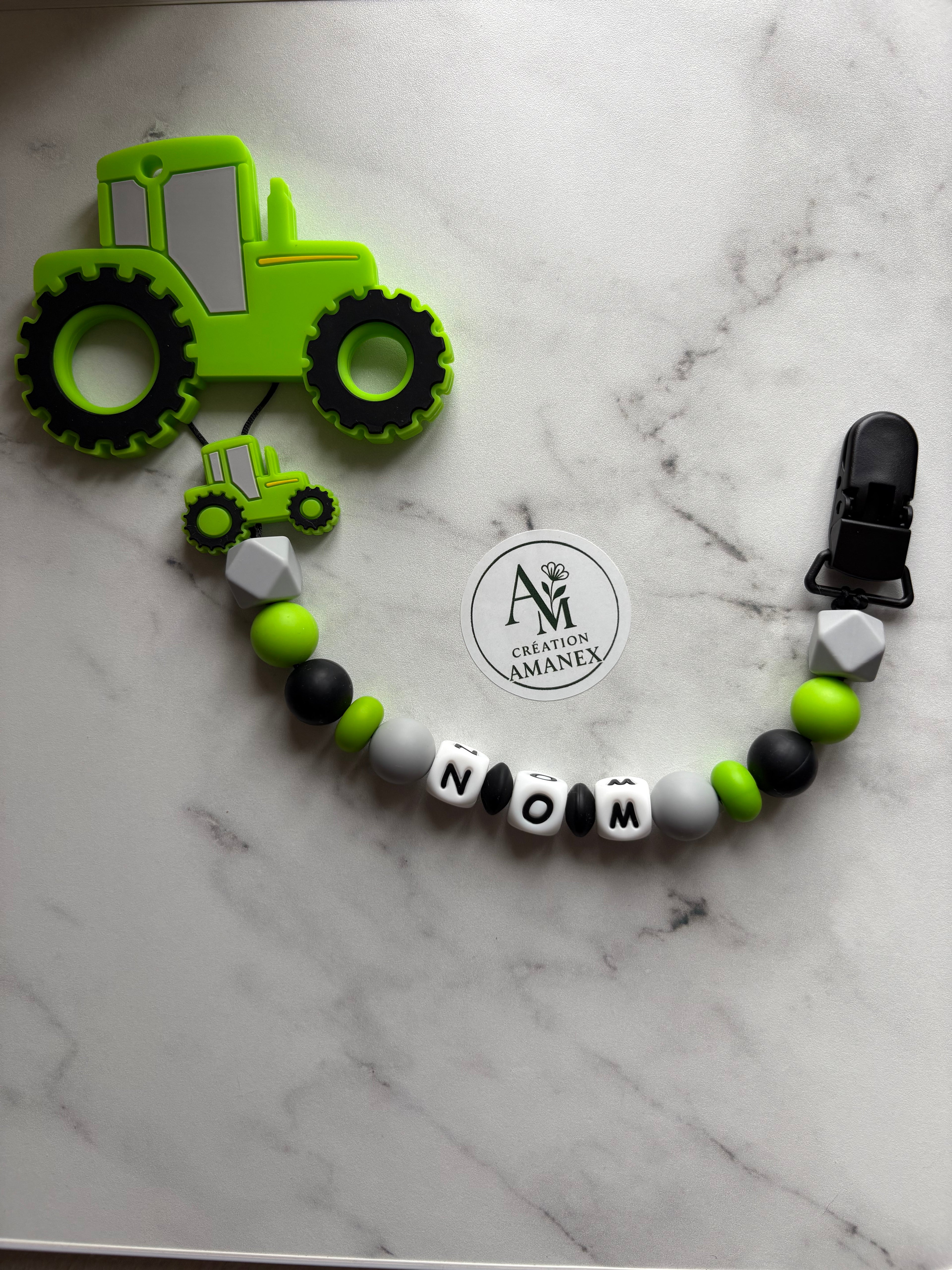 Attache suce et jouet de dentition Tracteur vert