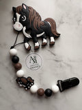 Attache suce et jouet de dentition Cheval noir