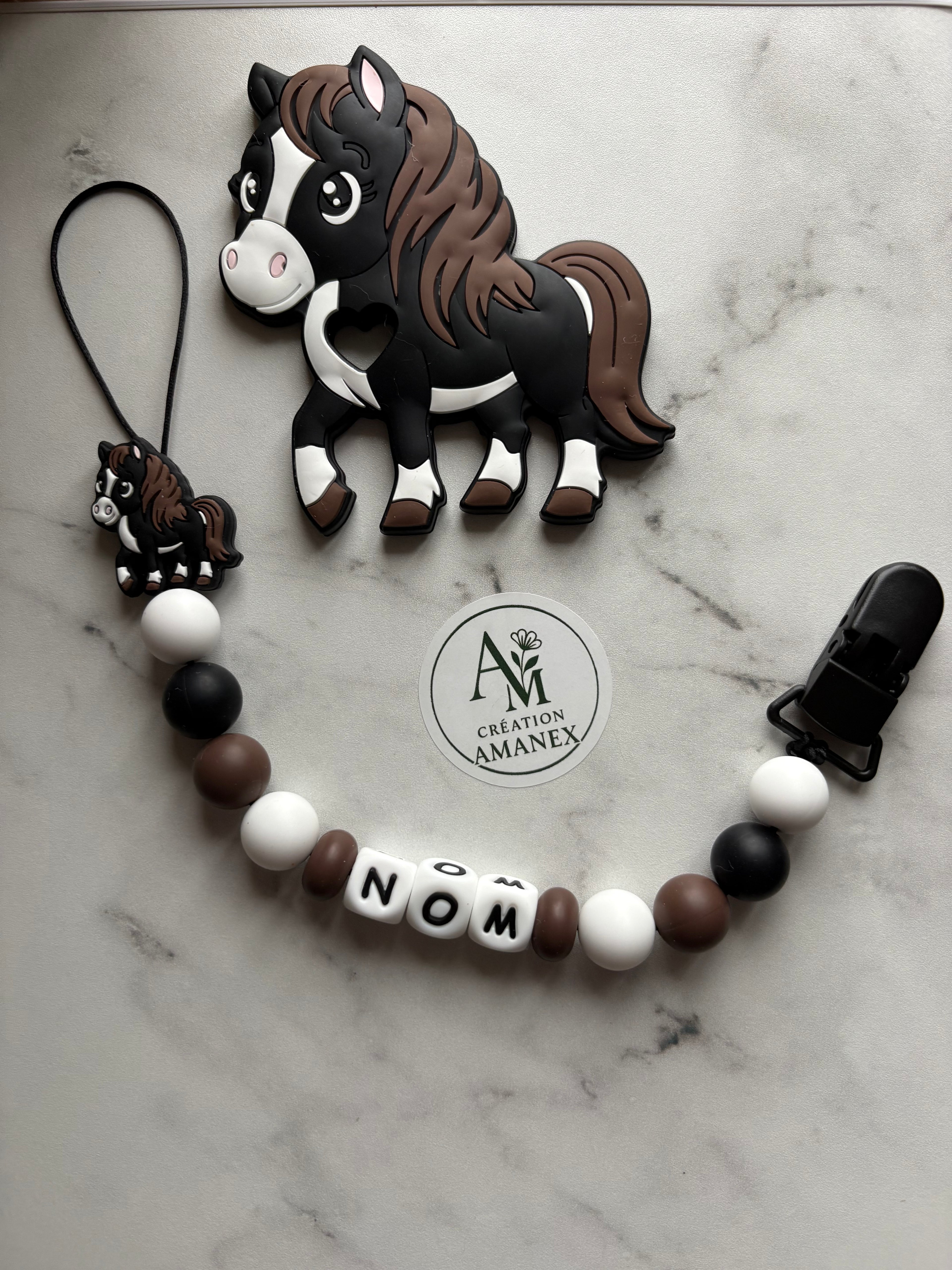 Attache suce et jouet de dentition Cheval noir